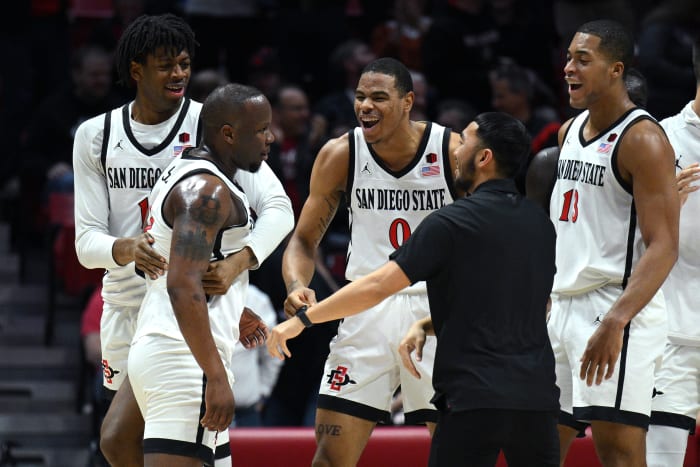 an Diego, California, USA; San Diego State Aztecs guard Adam Seiko (2) is congratulated after a three-point basket during the first half against the Utah State Aggies at Viejas Arena.